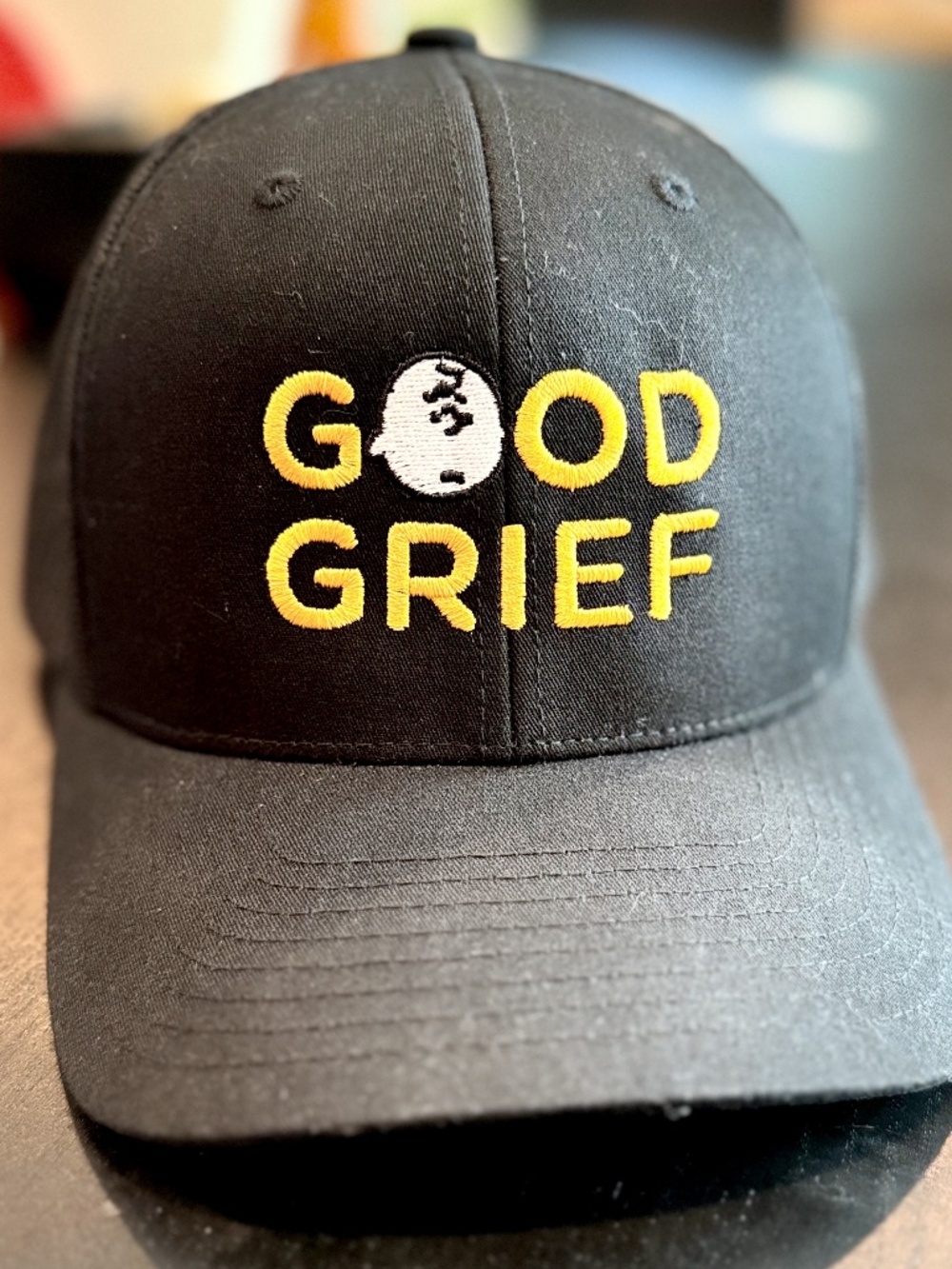 Peanuts GOOD GRIEF Embroidered Charlie Brown Trucker Hat, Black, One Size